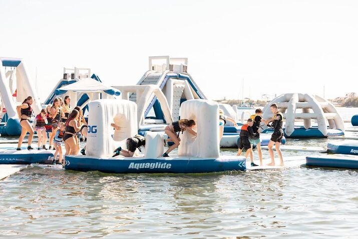 activities-to-do-in-gold-coast Activities to do in gold coast include tackling a floating inflatable obstacle course at GC Aqua Park, with kids and adults climbing and sliding on the water